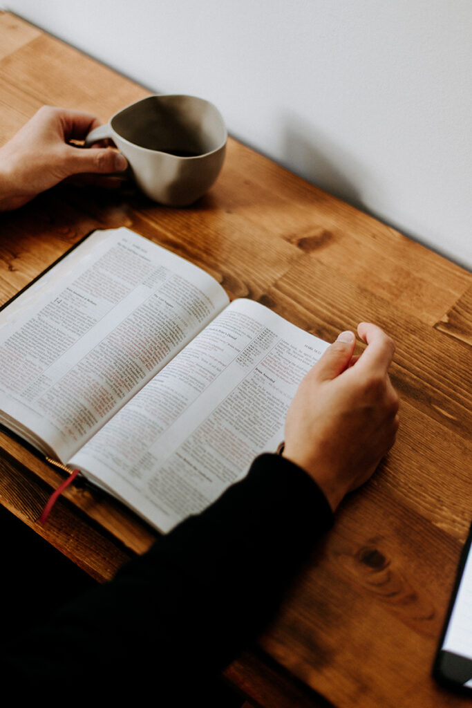 Reading the bible with a cup of coffee