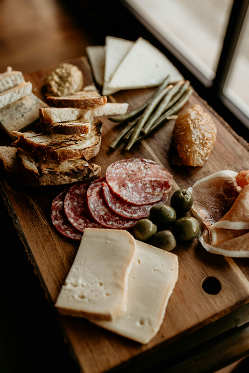 cheese, meat, olives, and whole grain crackers