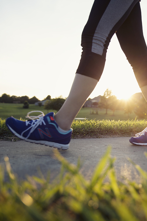 Woman walking at dawn to help insulin resistance