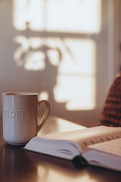 Bible Verses to Read in the Morning - open bible and coffee cup on a table
