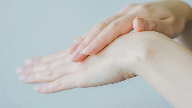 Woman rubbing hands, using the best diabetic lotion for dry skin on hands and feet Woman rubbing hands, using the best diabetic lotion for dry skin on hands and feet