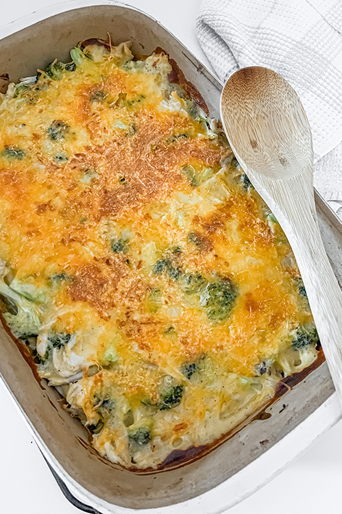 chicken and broccoli casserole after baking with spoon on top