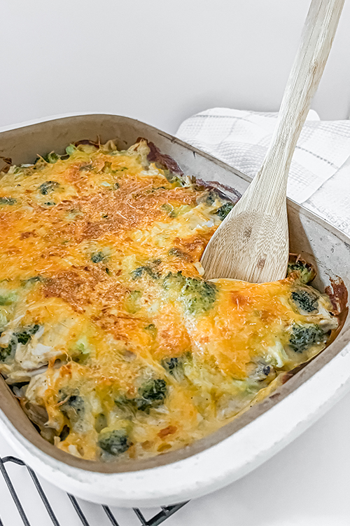 chicken and broccoli casserole after baking with spoon in dish